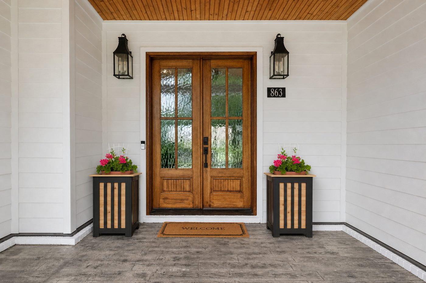 Pair of Camden Collection planters flanking a front door