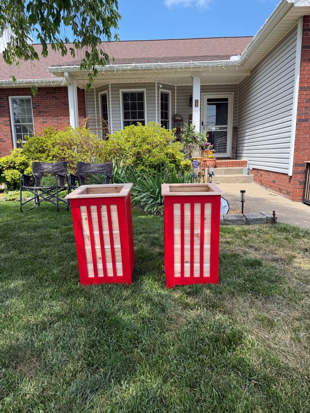 Pair of red custom color cedar planters matched to the customer's home