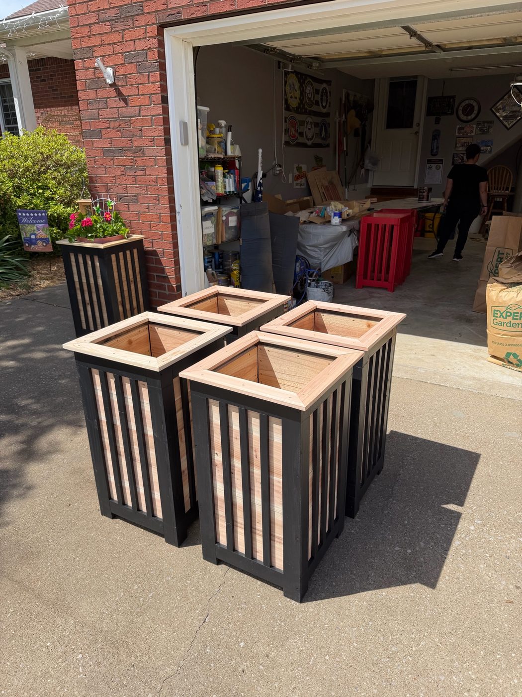 Finished black and cedar planter boxes ready for delivery